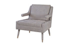 Design fauteuil met gestoffeerde poten en brushed bronze details