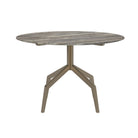 Ronde eettafel in grijs travertijn met modern bronzen frame